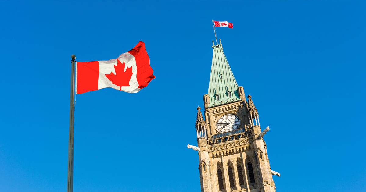 Canada Parliament and Canadian Flag over blue sky