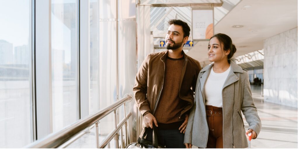 Couple walking in airport terminal