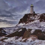 Lighthouse on snowy coast