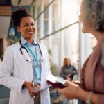 A Doctor speaks with a patient