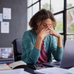 Frustrated woman sitting at a desk