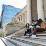 Students studying outdoors at university